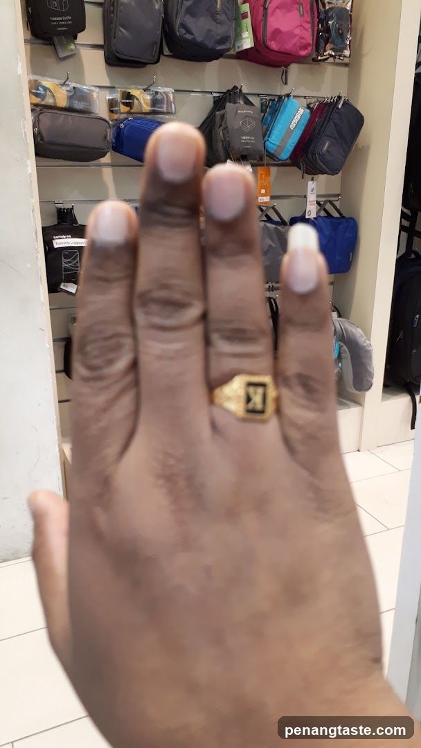 Hand with Ring in Store Interior