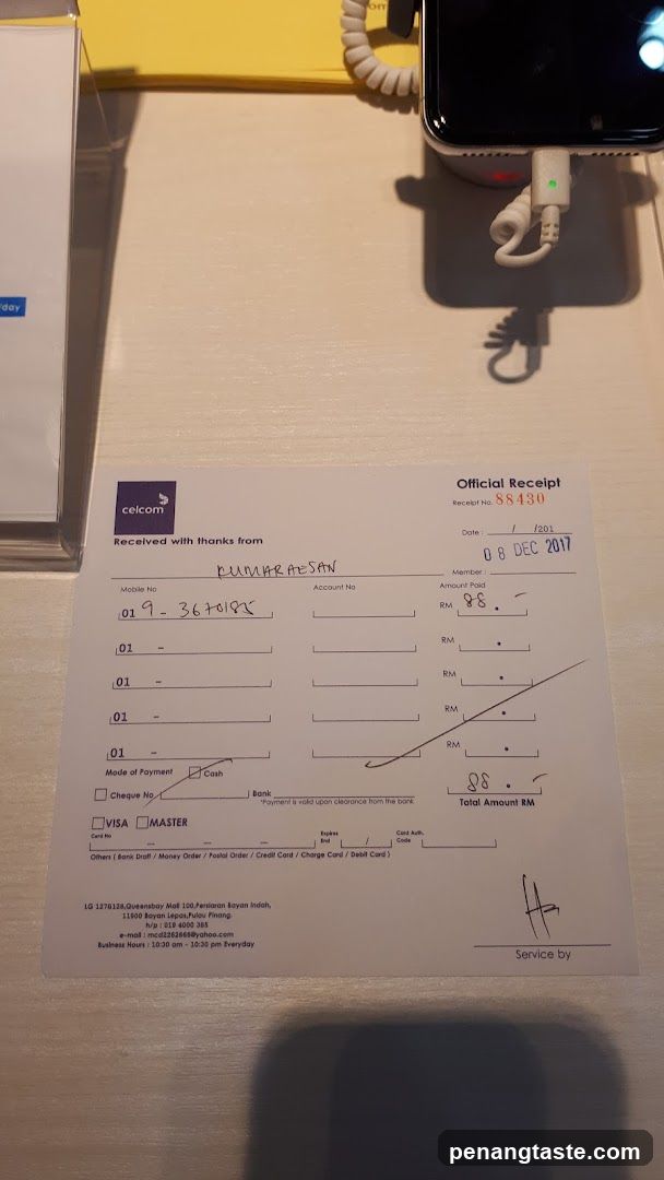 Celcom Official Receipt on Table