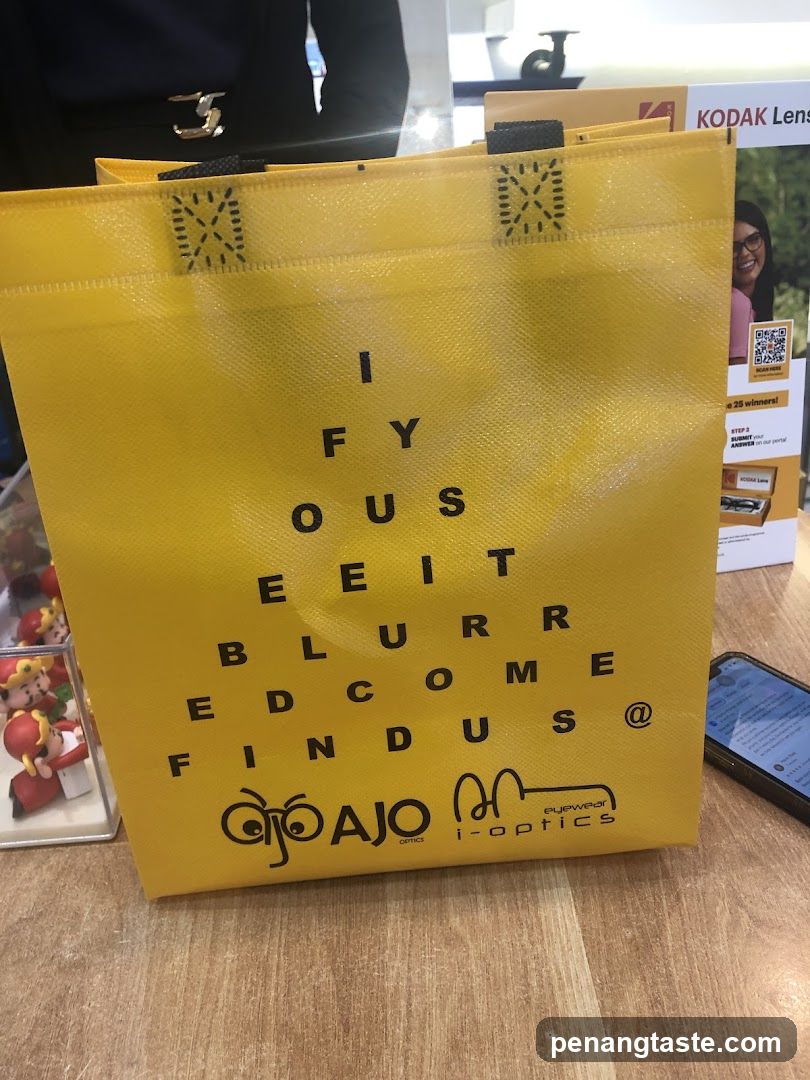 Yellow Shopping Bag with Eye Chart Design