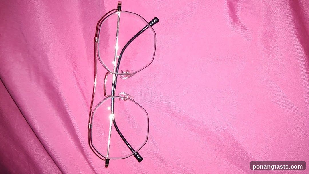 Eyeglasses on Pink Fabric