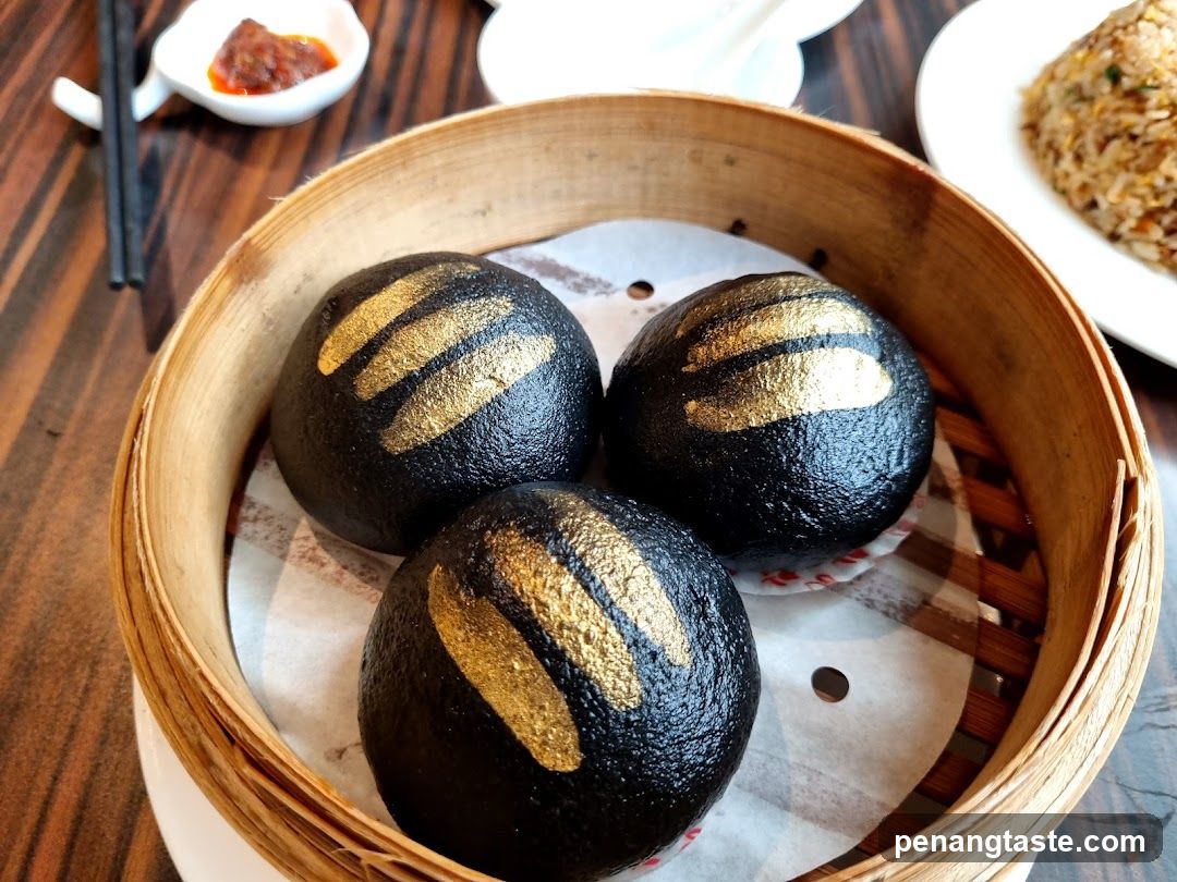 Black Steamed Buns with Gold Accents