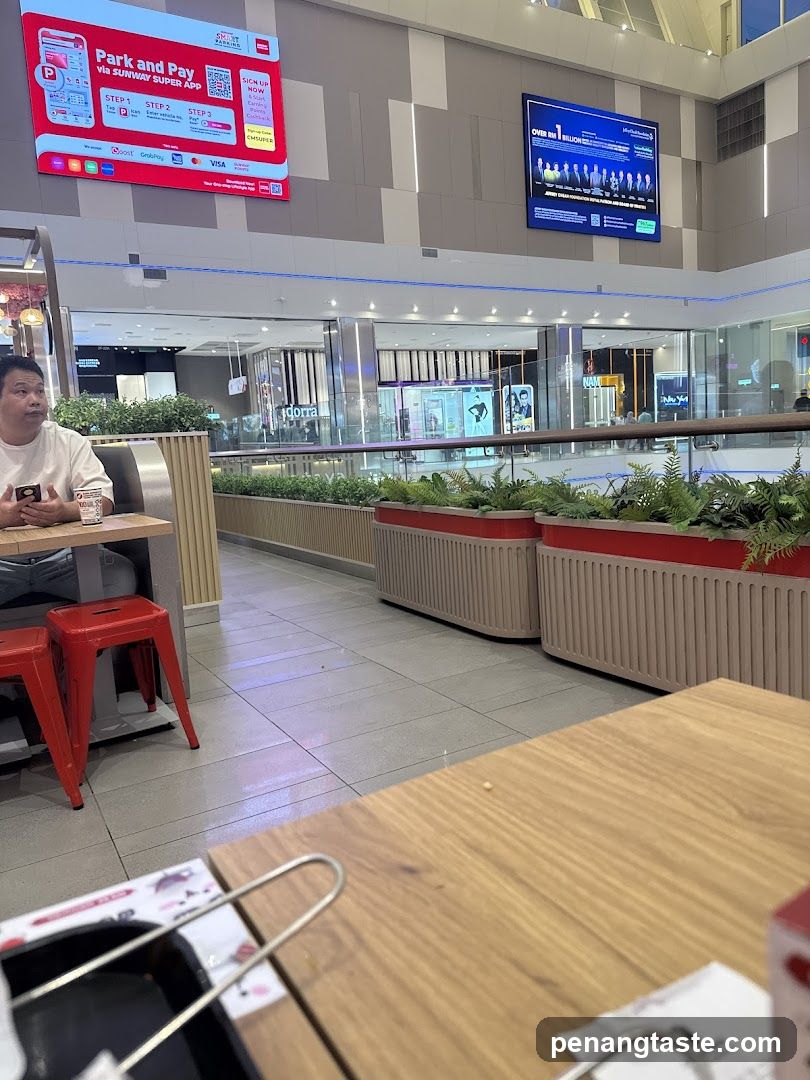 Mall Interior with Dining Area and Digital Displays