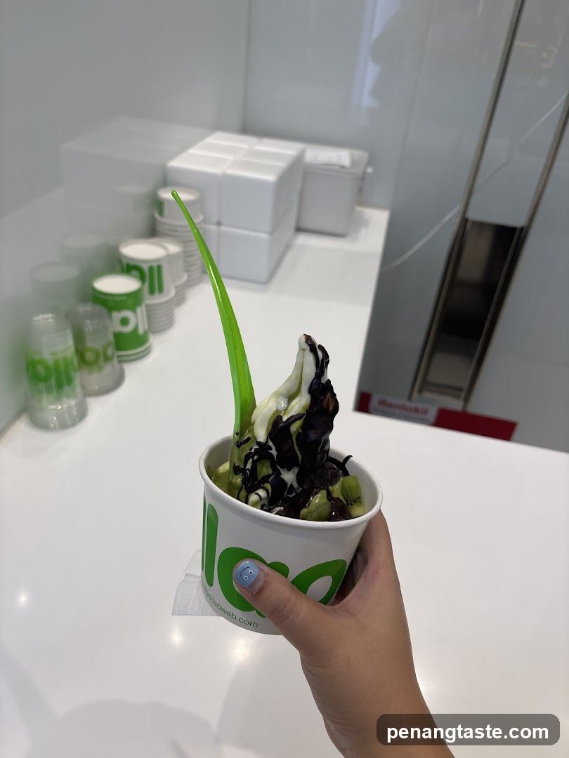 Green Ice Cream Cup with Chocolate Drizzle