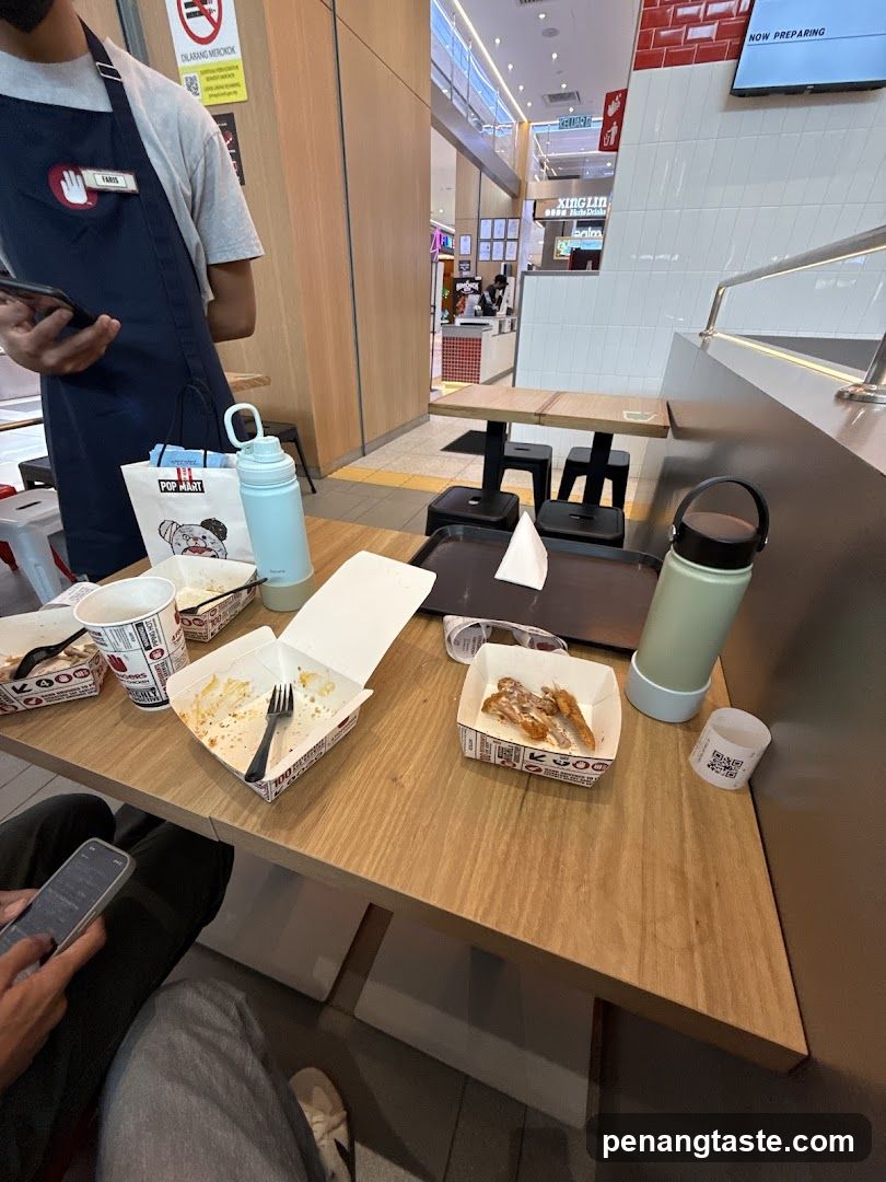 Food Table with KFC Containers and Water Bottles