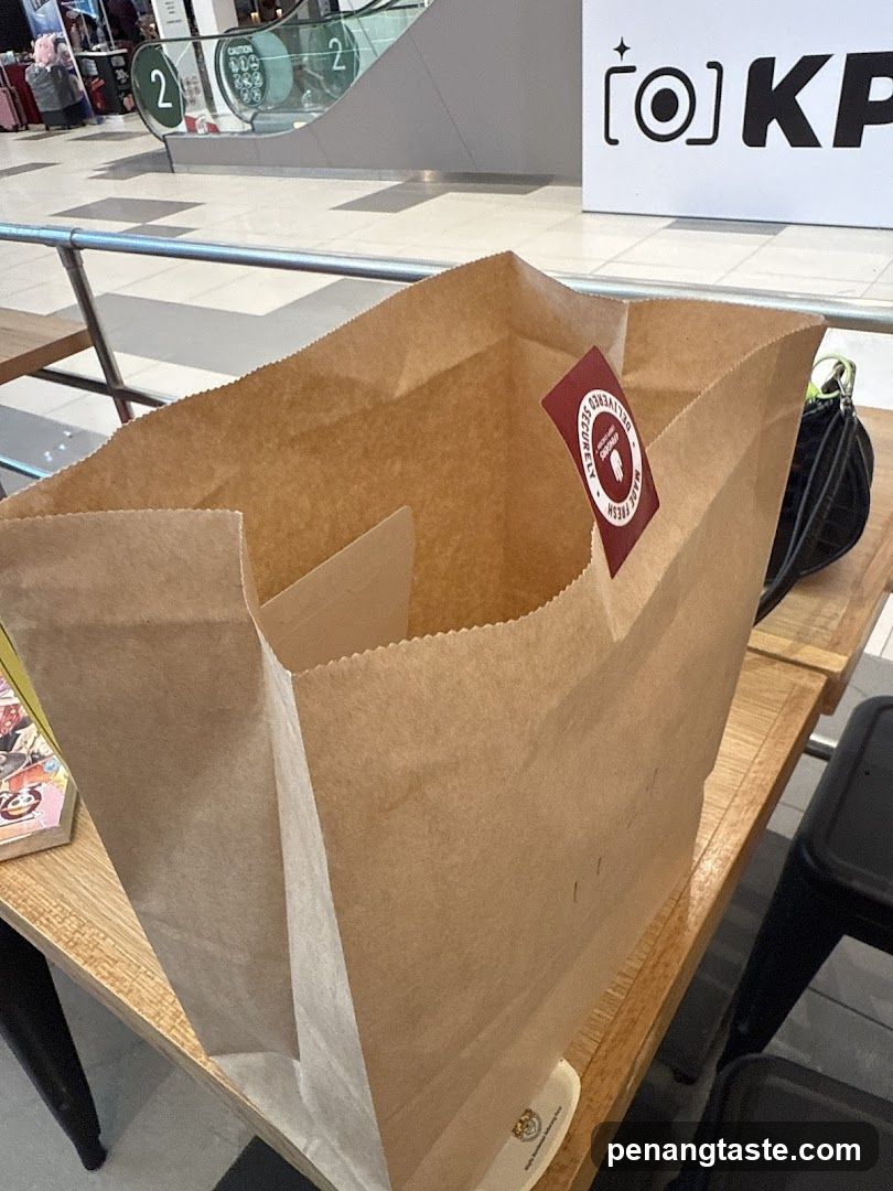 Brown paper bag on table in mall