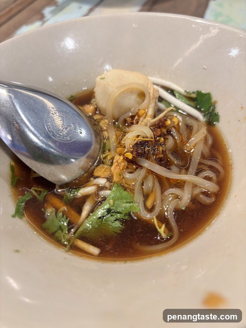 Bowl of Noodle Soup with Garnish