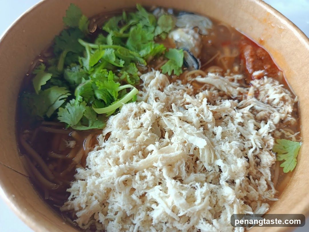 Bowl of Noodle Soup with Chicken and Cilantro
