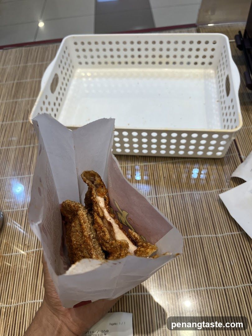 Food Item in Paper Wrapper with Empty Basket