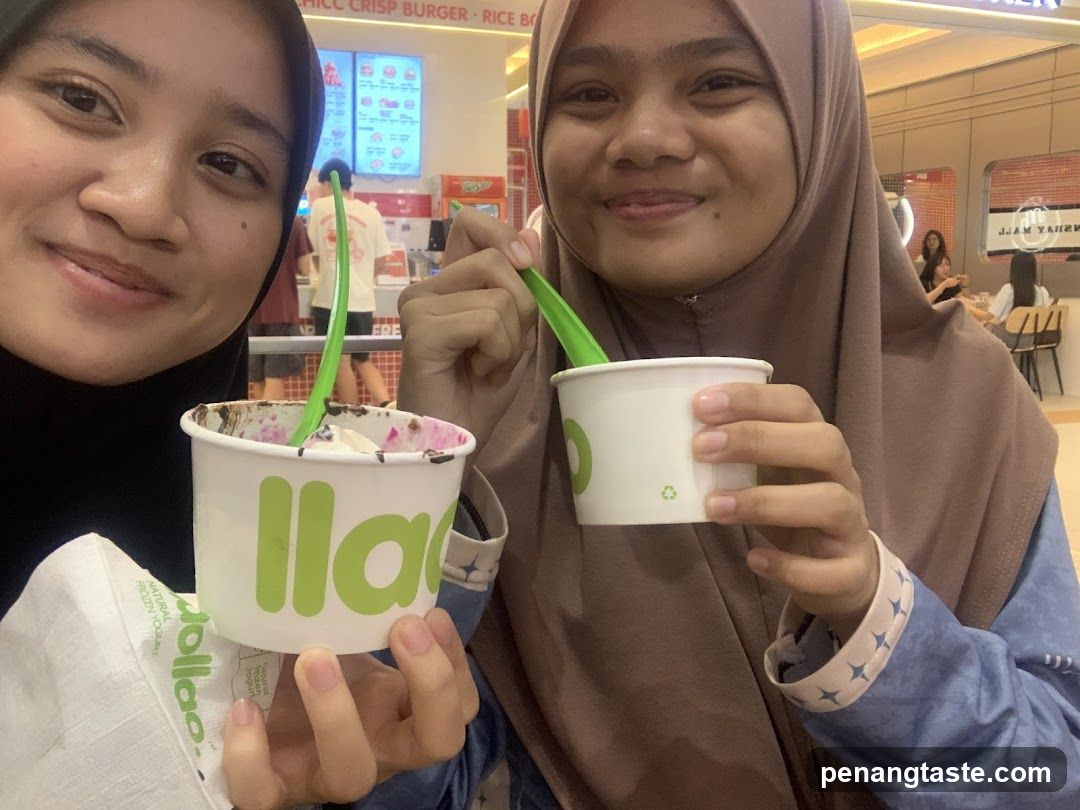 Two women enjoying ice cream in a mall food court