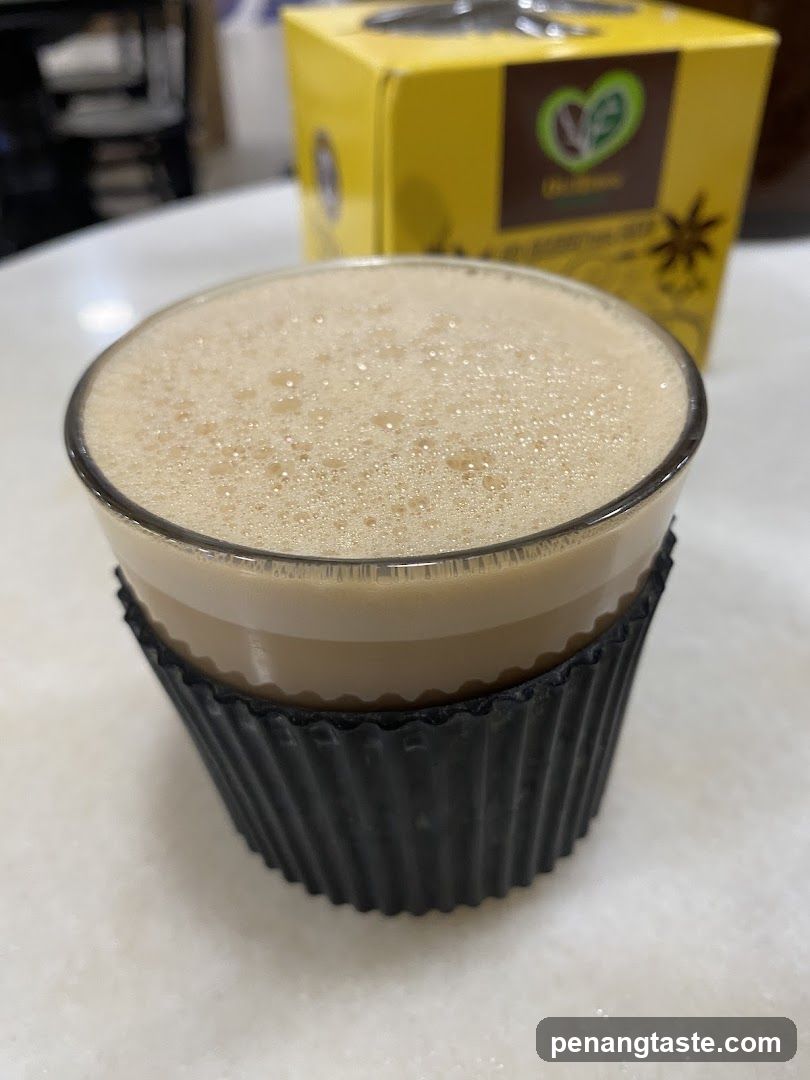 Beverage with foam in glass cup