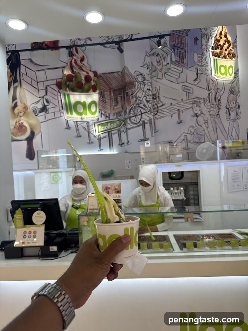 Ice cream shop interior with staff and customer holding cup
