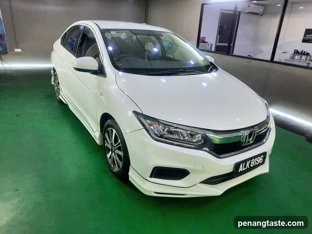White Honda City Sedan in Car Detailing Shop