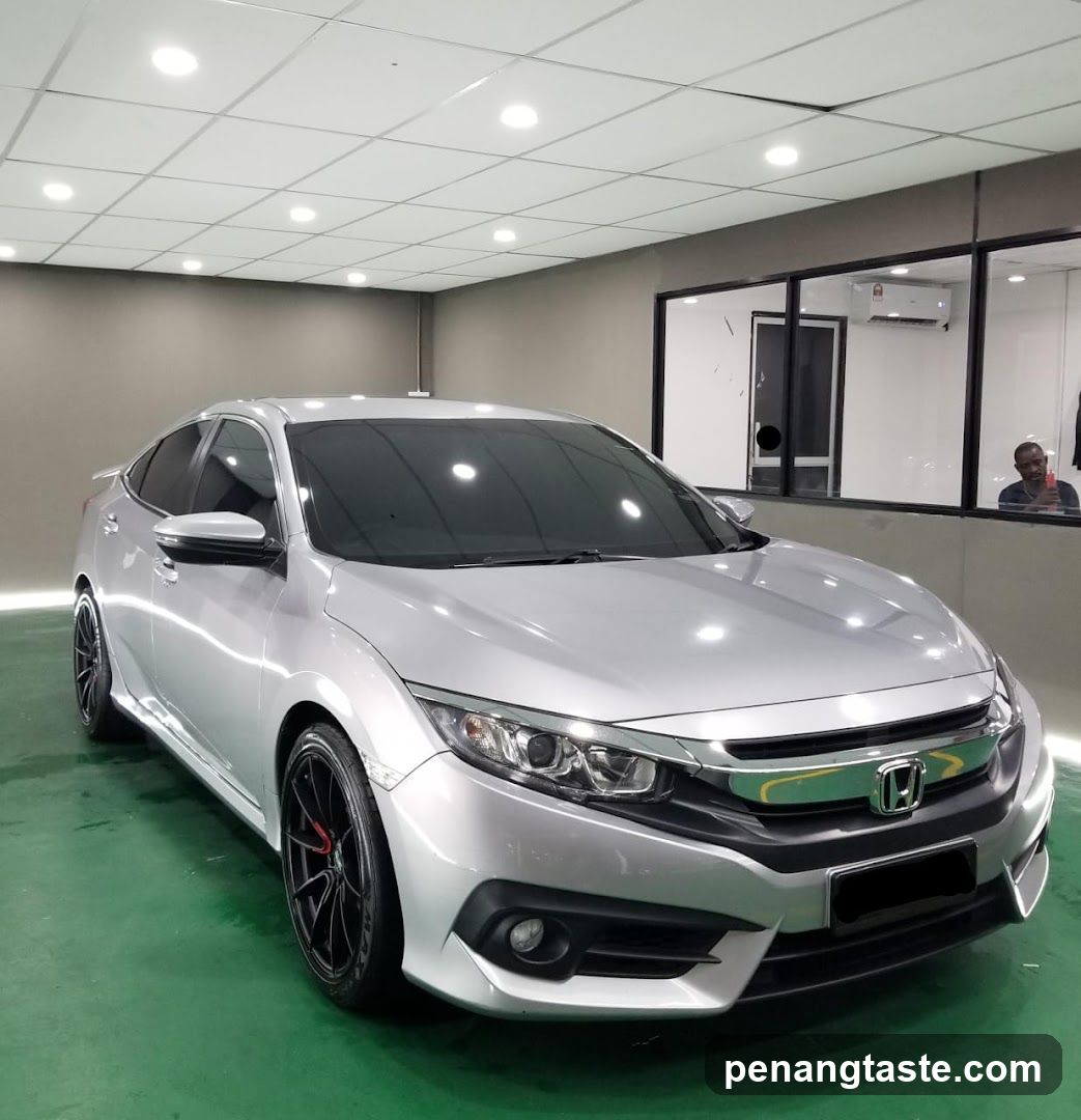 Silver Honda Civic in showroom