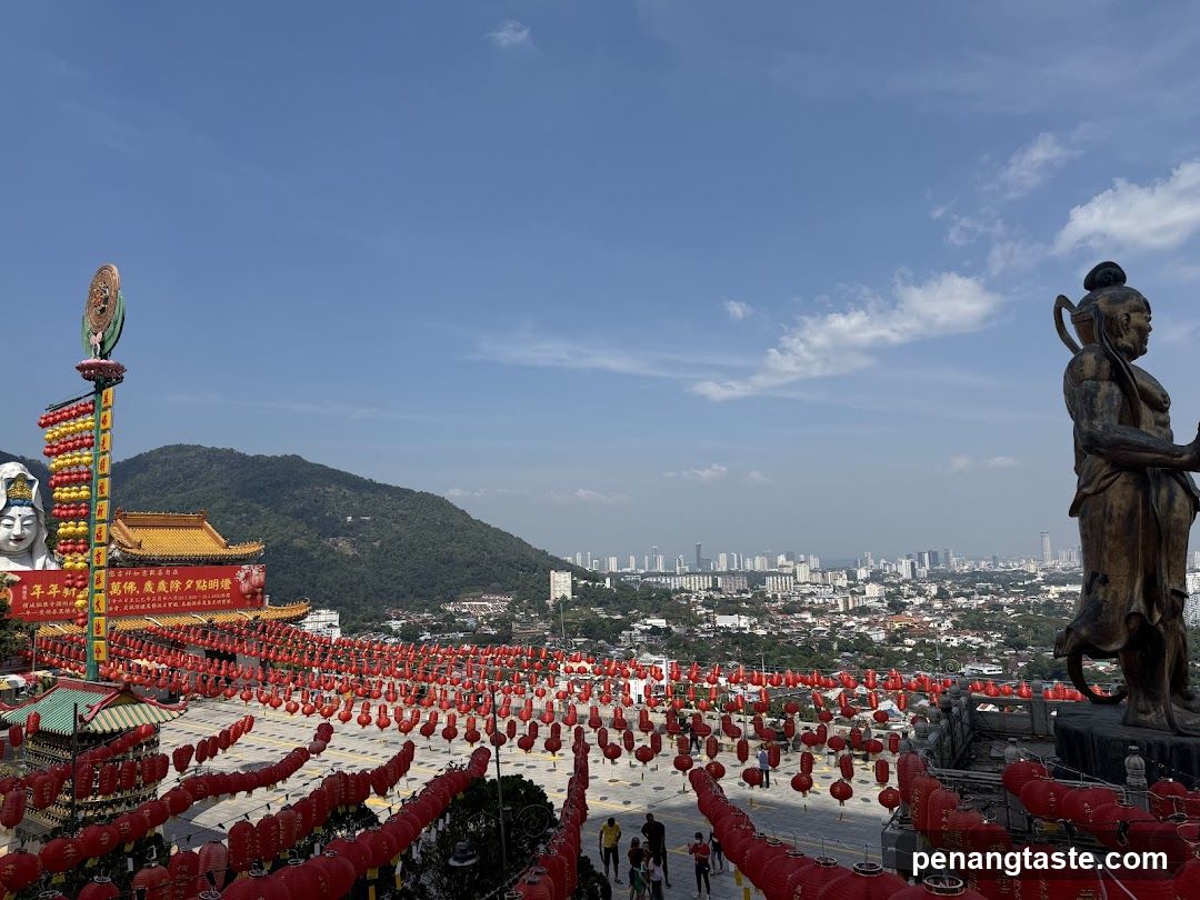 Temple View with Red Lanterns and Statue