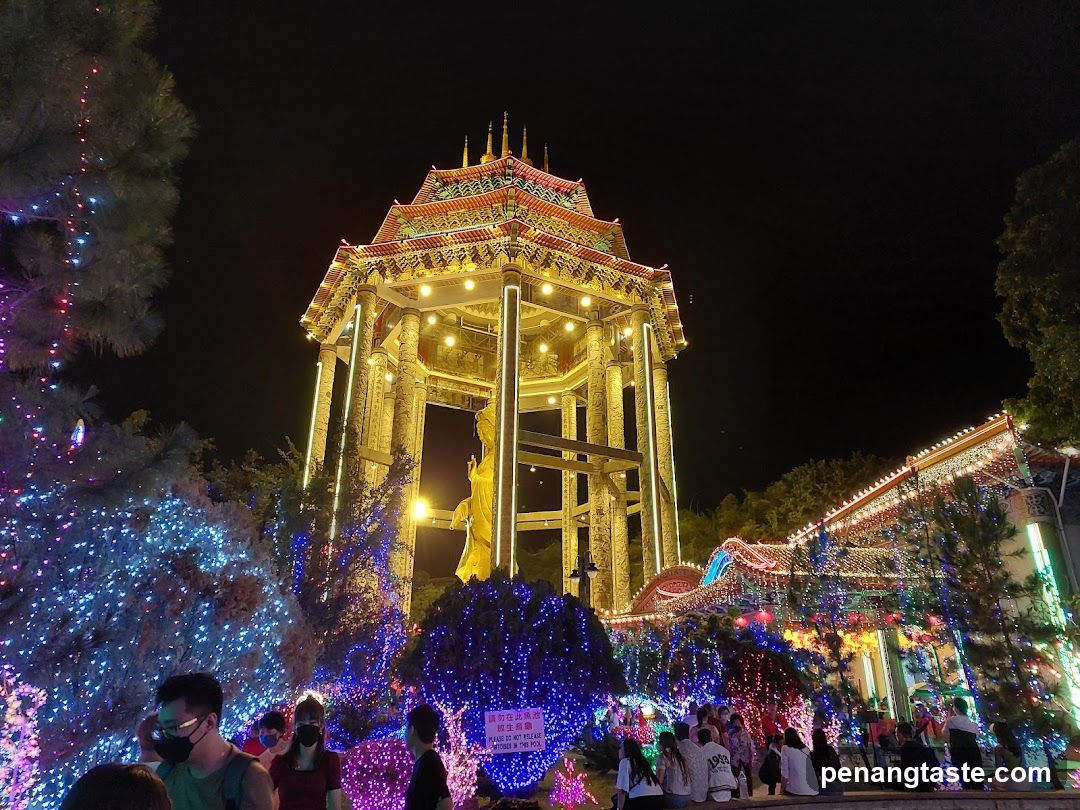 Night Festival Scene with Illuminated Pagoda and Crowd