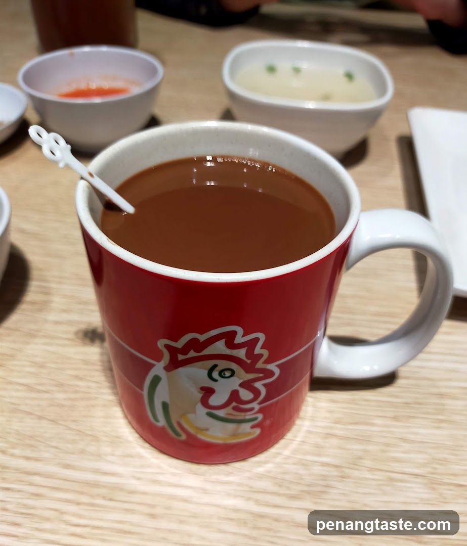Red Mug with Chicken Logo and Side Dishes