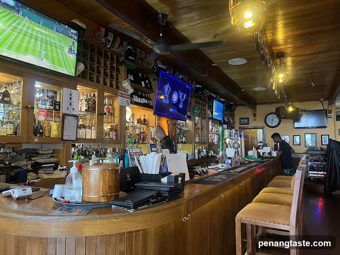 Bar Interior with TV Screens and Wooden Bar Counter