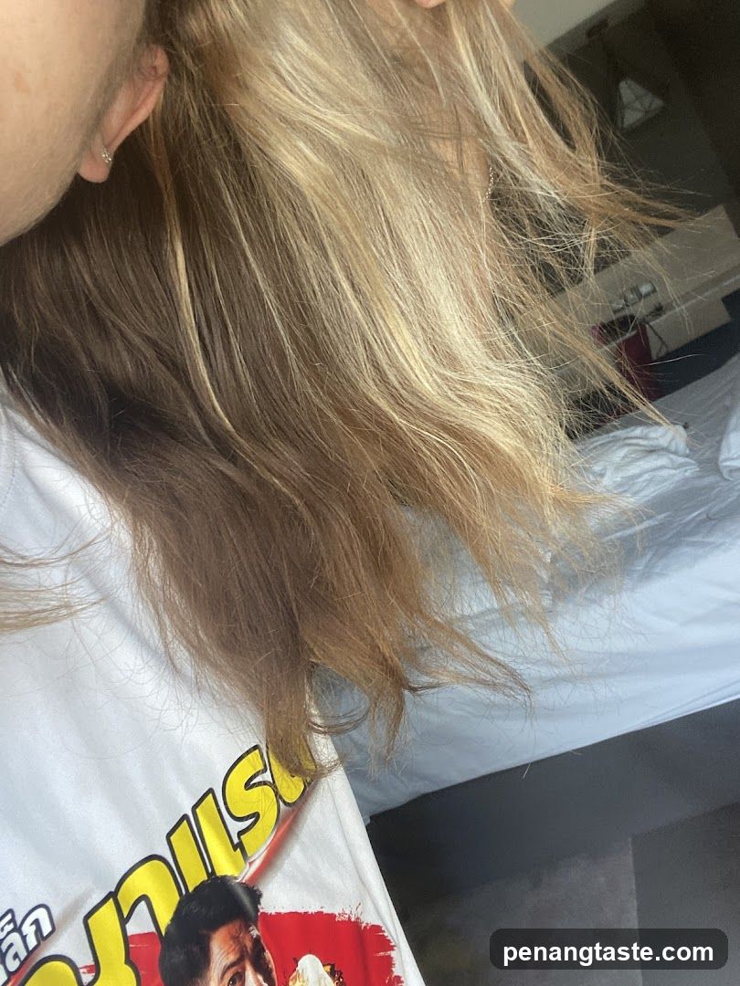 Person with long hair in a room