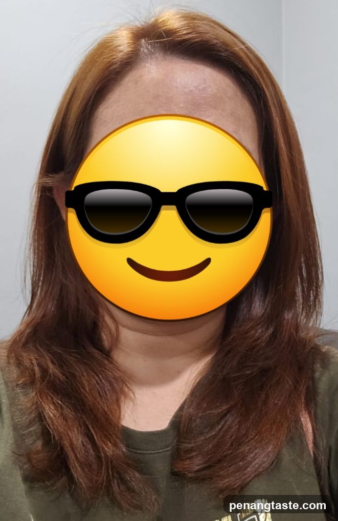 Person with emoji face cover