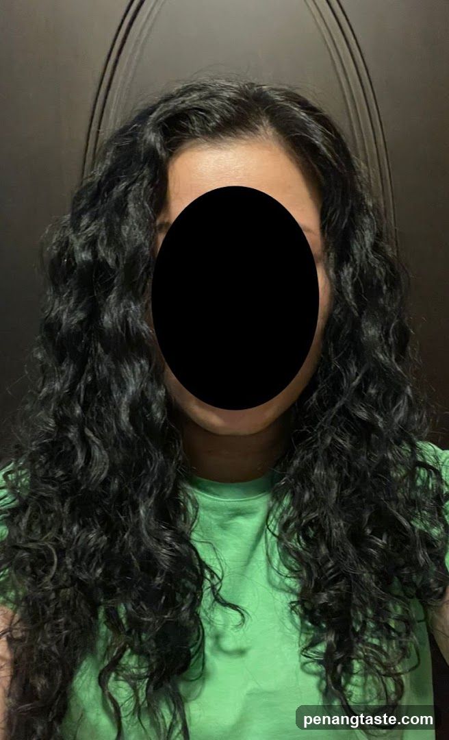 Person with long curly hair