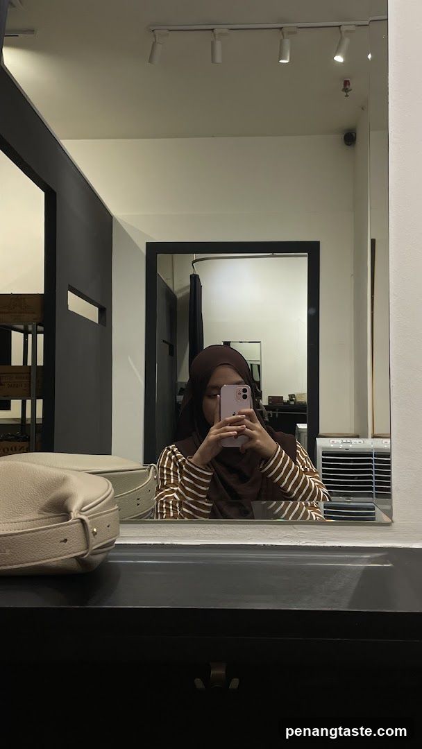 Mirror selfie in a modern interior space