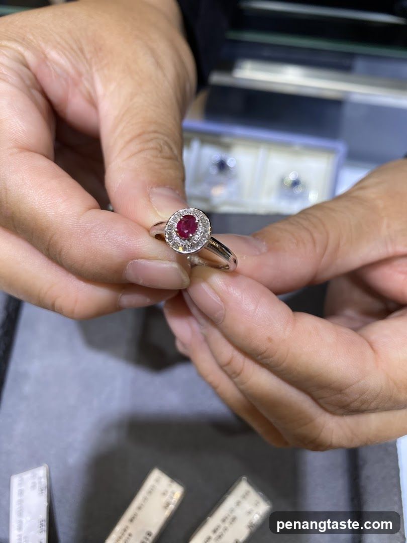 Rings being held by hands in a jewelry store