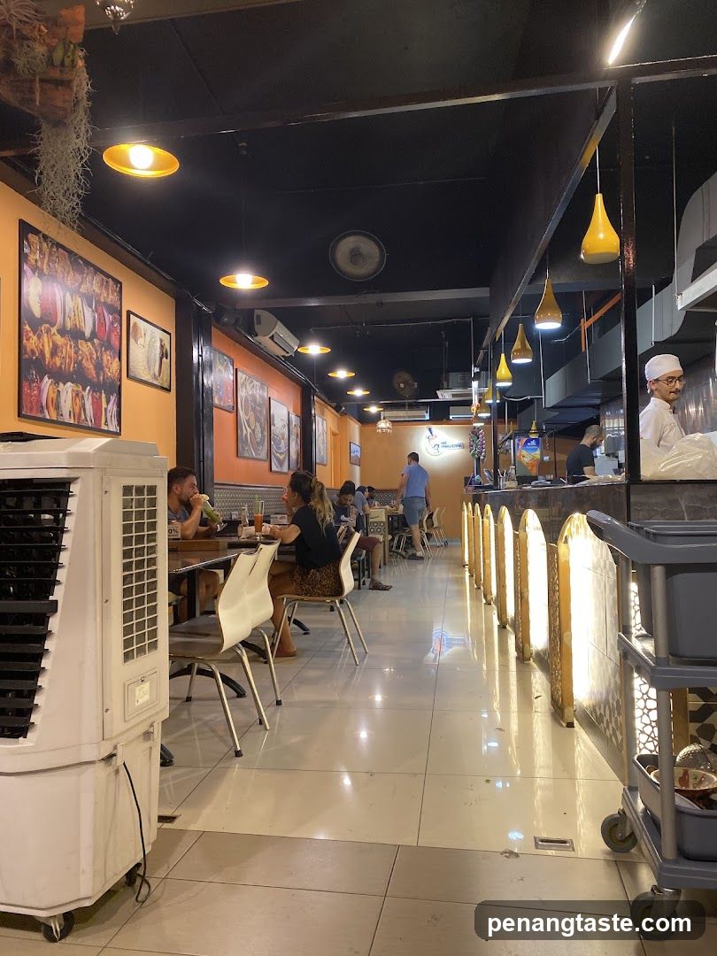 Restaurant Interior with Dining Area and Kitchen View