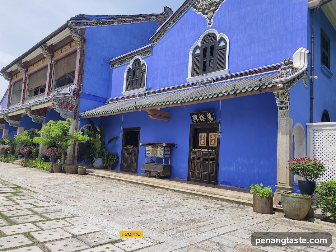 Blue Building Exterior with Shop Entrance