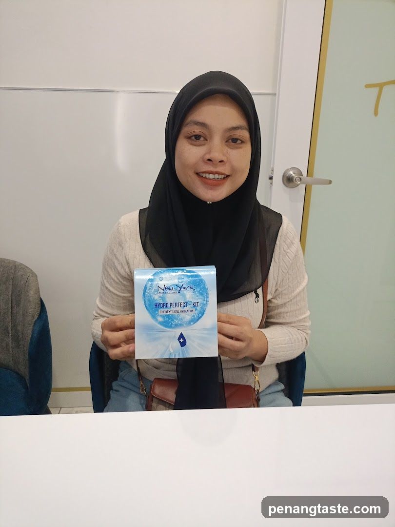 Woman holding skincare product box