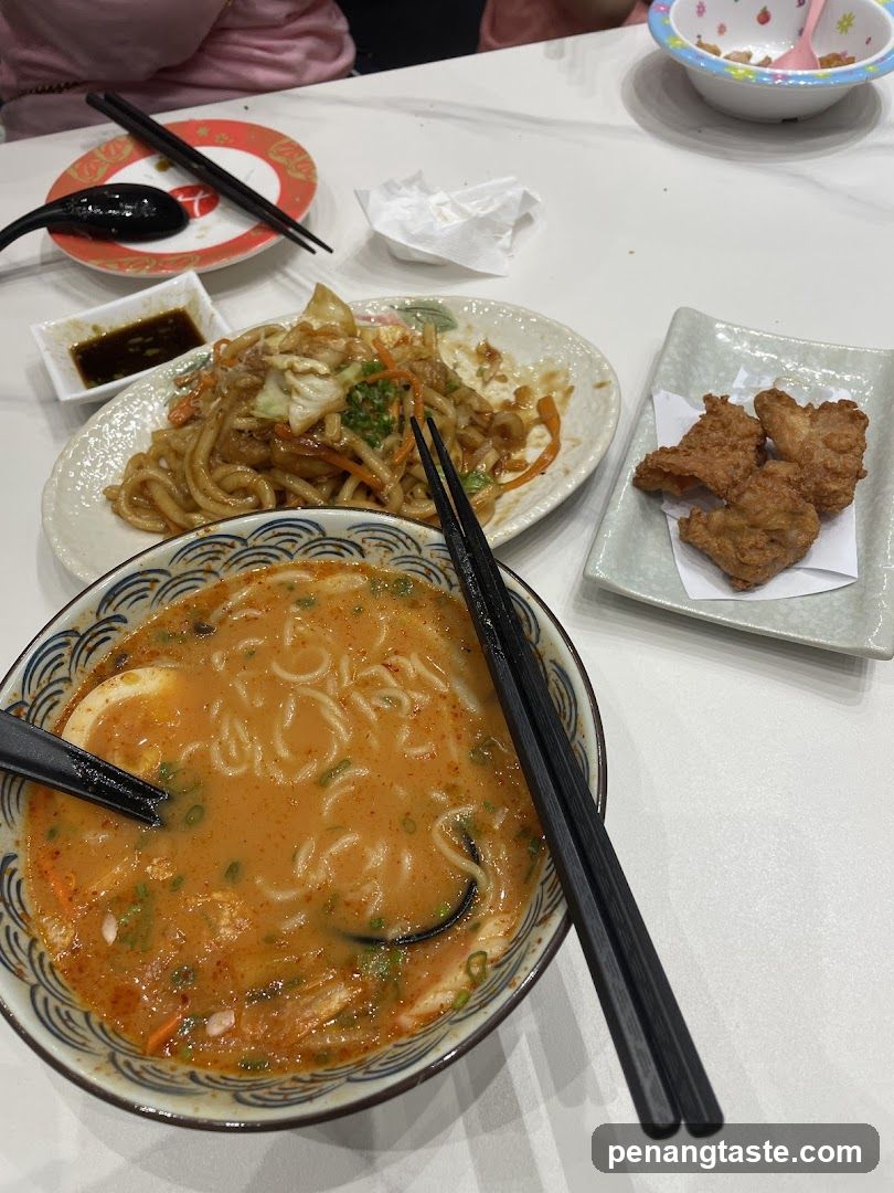 Ramen and Side Dishes at a Restaurant Table