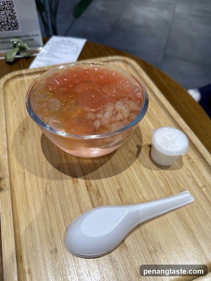 Bowl of Pink Dessert with Side Condiment