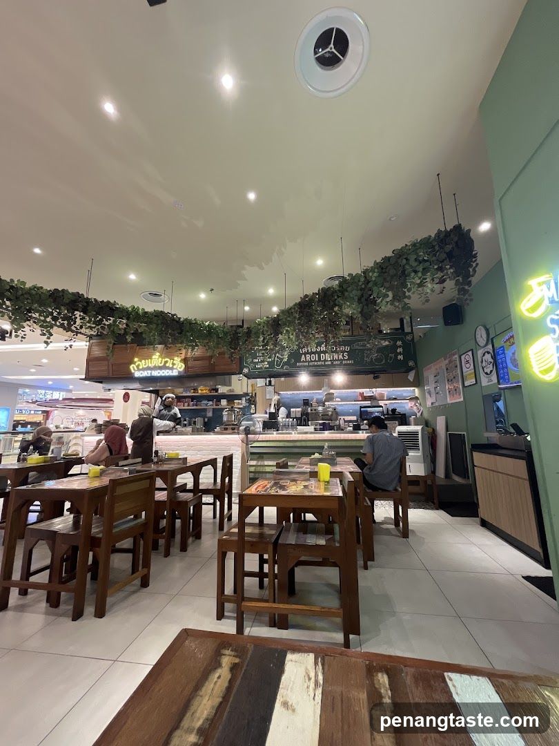 Restaurant Interior with Hanging Greenery and Dining Tables