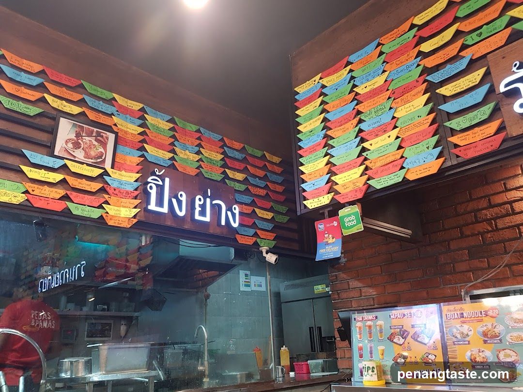 Restaurant Interior with Menu Boards and Staff