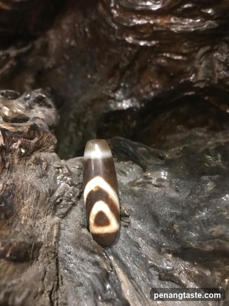 Agate bead on rock