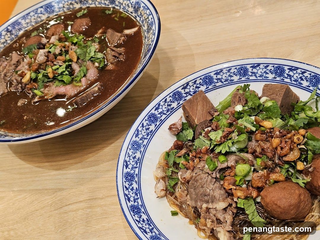 Noodle Dish with Toppings and Soup Bowl
