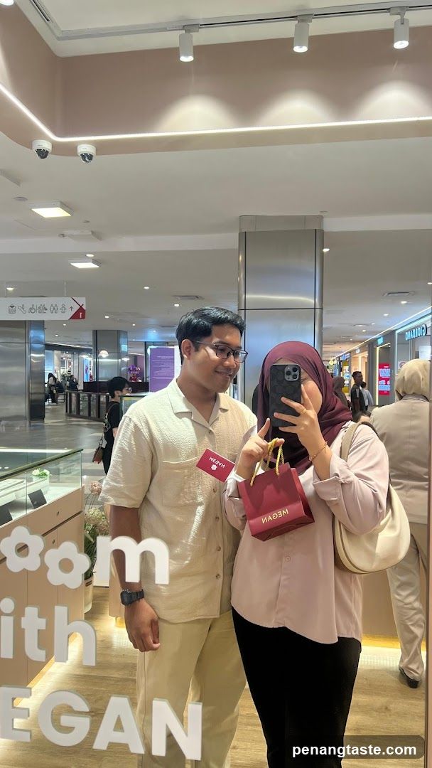 Couple in mall with shopping bags