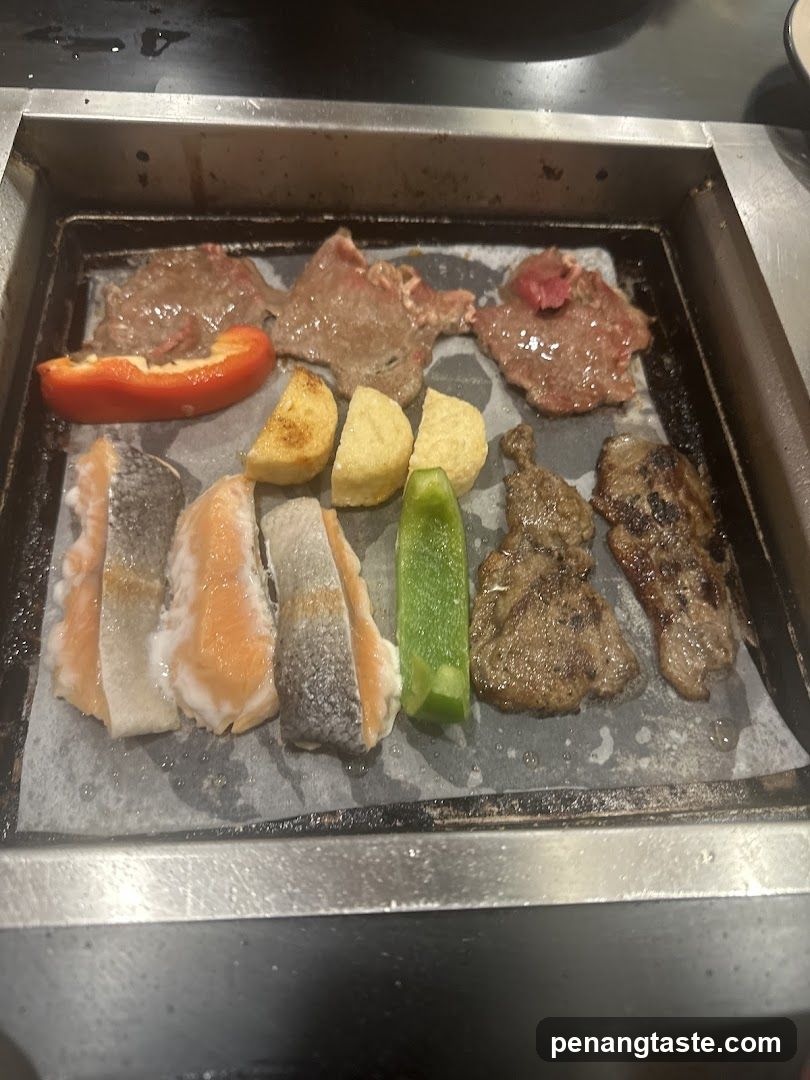 Grilled Meat and Vegetables on a Hot Plate