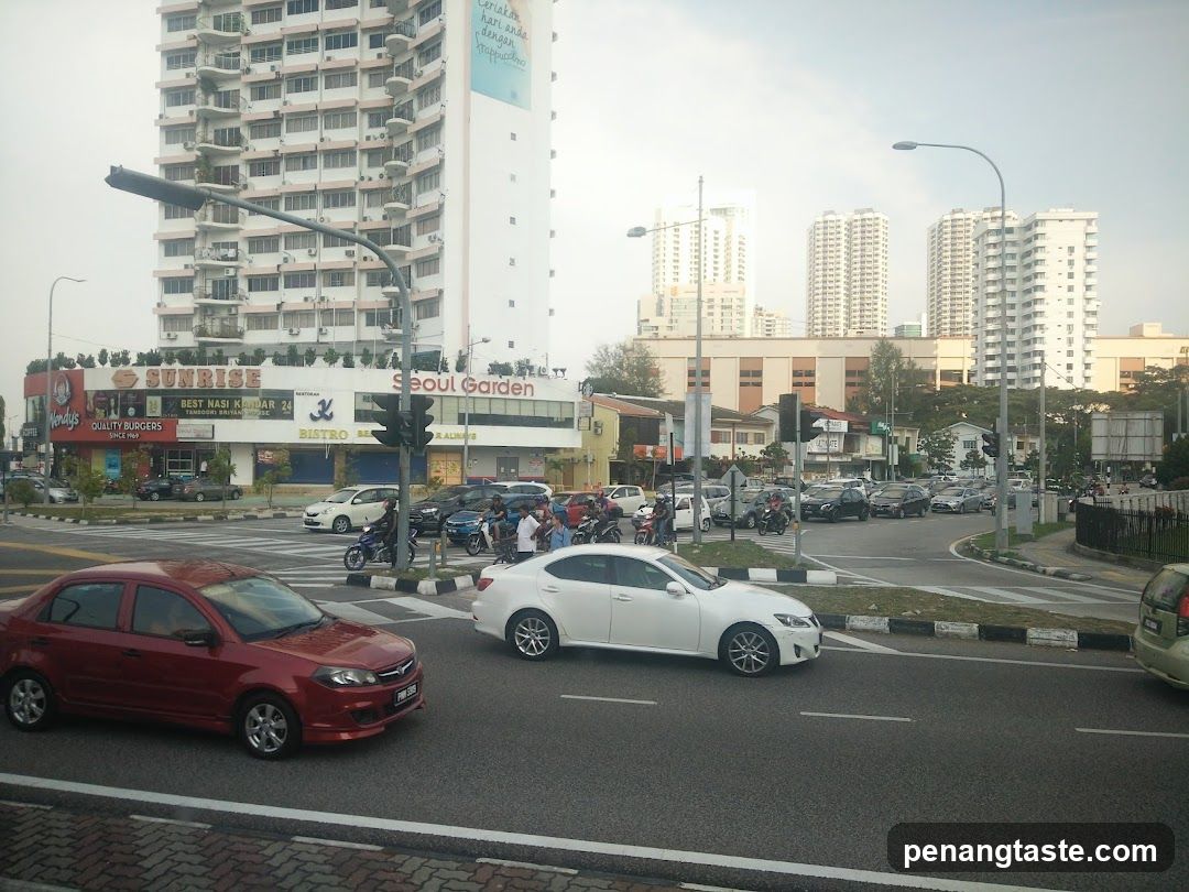 Urban Street Scene with Shops and Traffic
