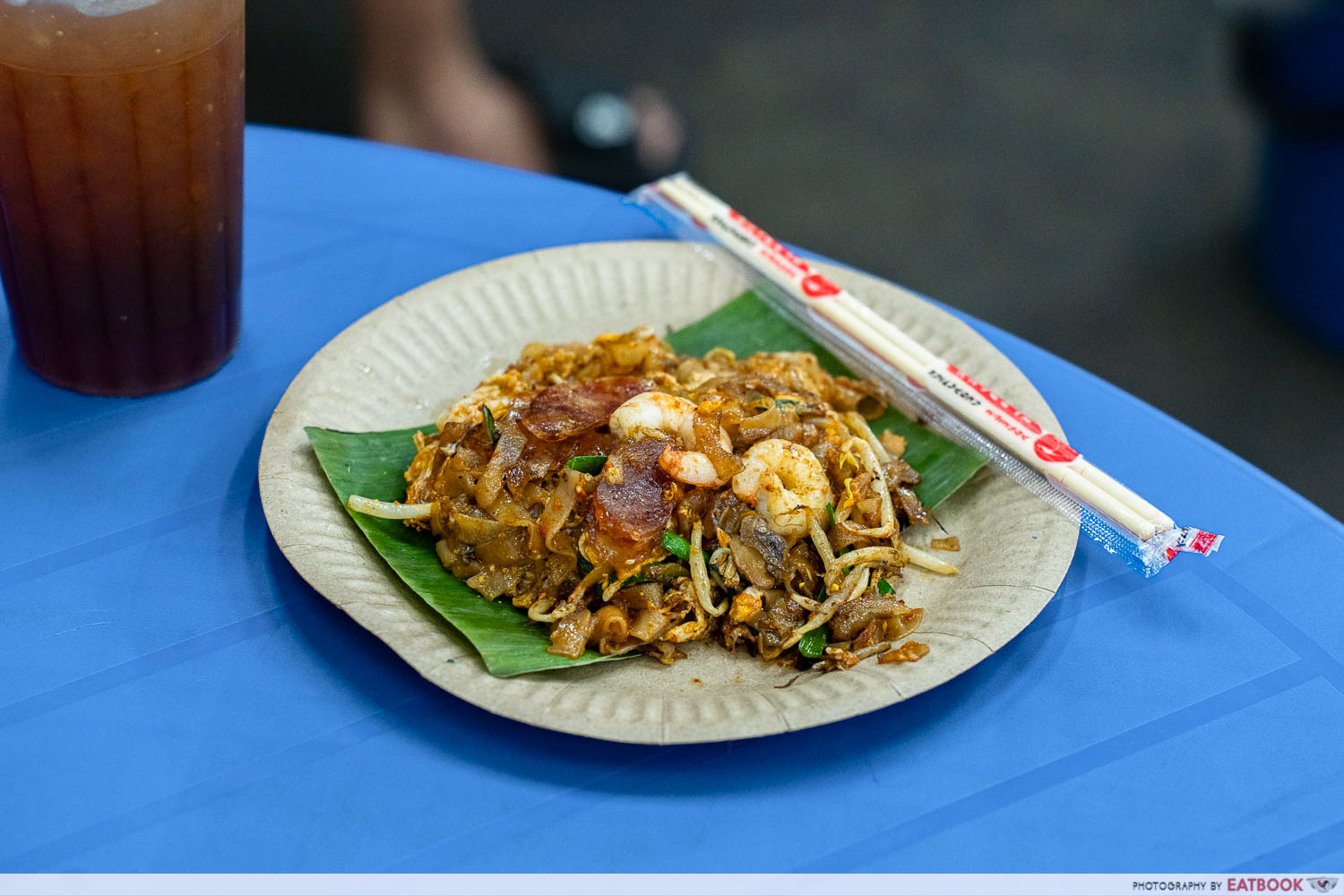 Barefoot Char Koay Teow plate with duck egg, cockles, and lap cheong at a Penang hawker centre