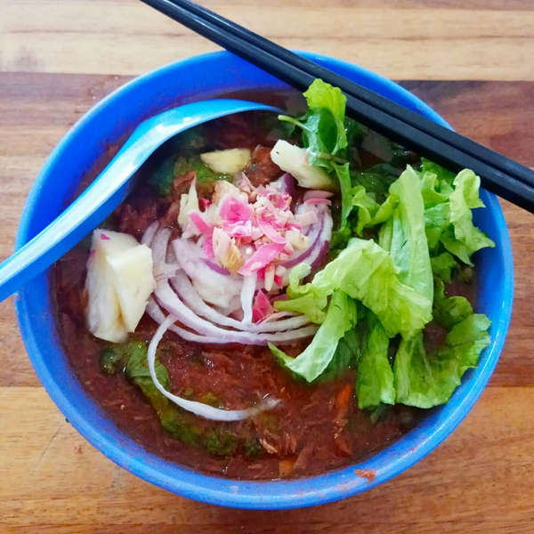Assam laksa at Penang Road Famous Laksa with generous slices of mackerel